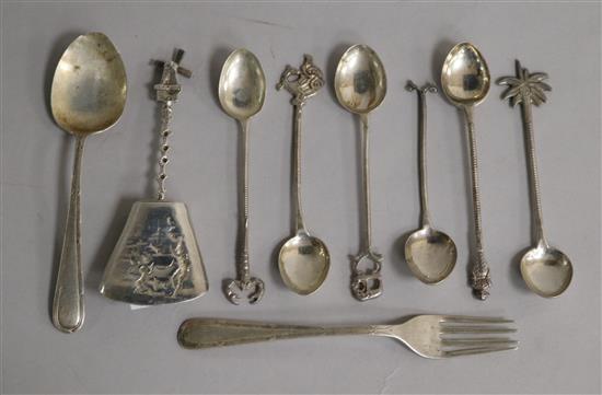 A Continental silver caddy spoon and eight other items.